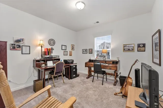 a view of a livingroom with furniture and a window