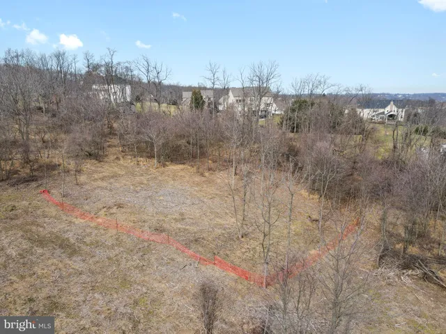 a aerial view of a house with a yard