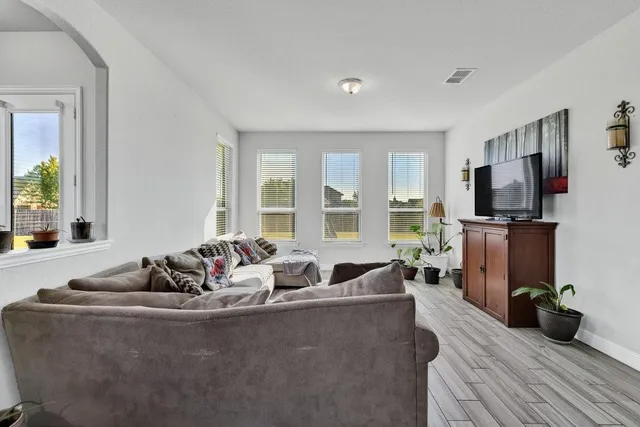 a bedroom with furniture and windows