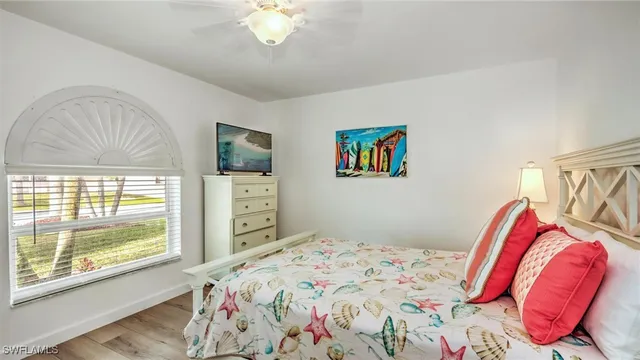 a bathroom with a sink a mirror a vanity and a shower