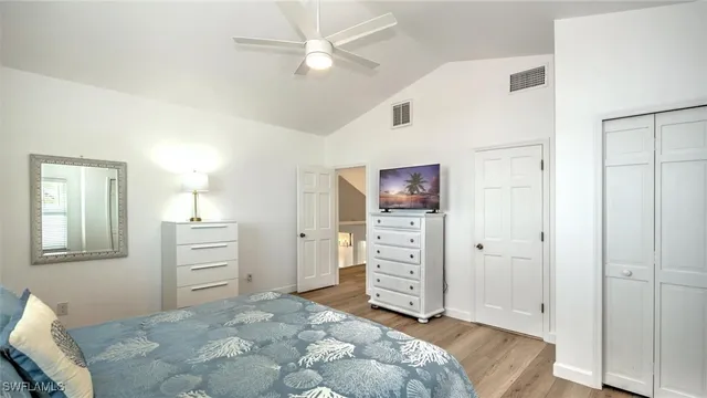 a en suite bathroom with a granite countertop sink and a mirror