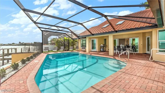a view of a swimming pool with a patio