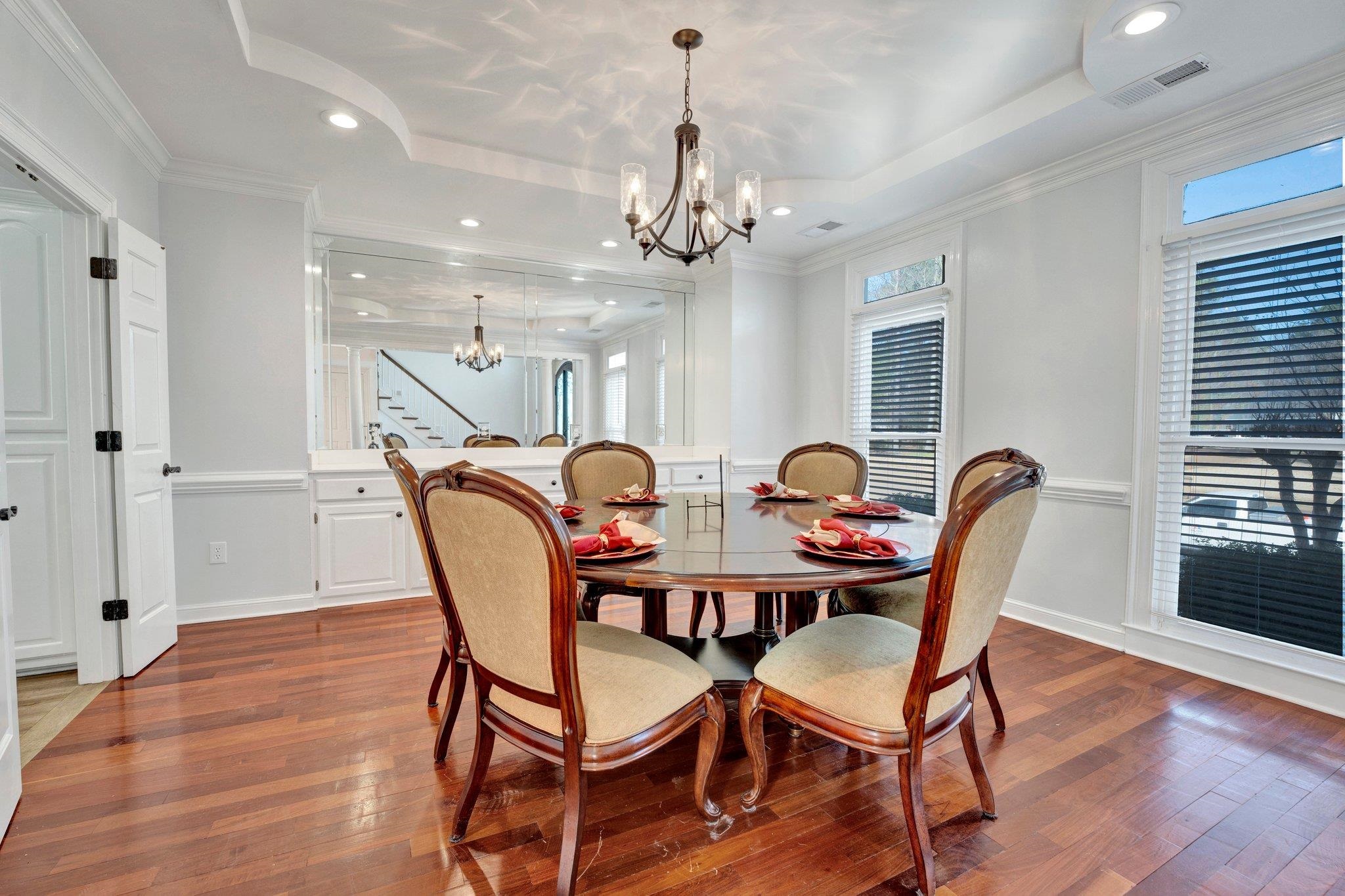 47 Summer Grove Road Memphis, TN 38018 - Photo 5 of 35 Dining area featuring dark wood finished floors, a notable chandelier, a raised ceiling, and visible vents