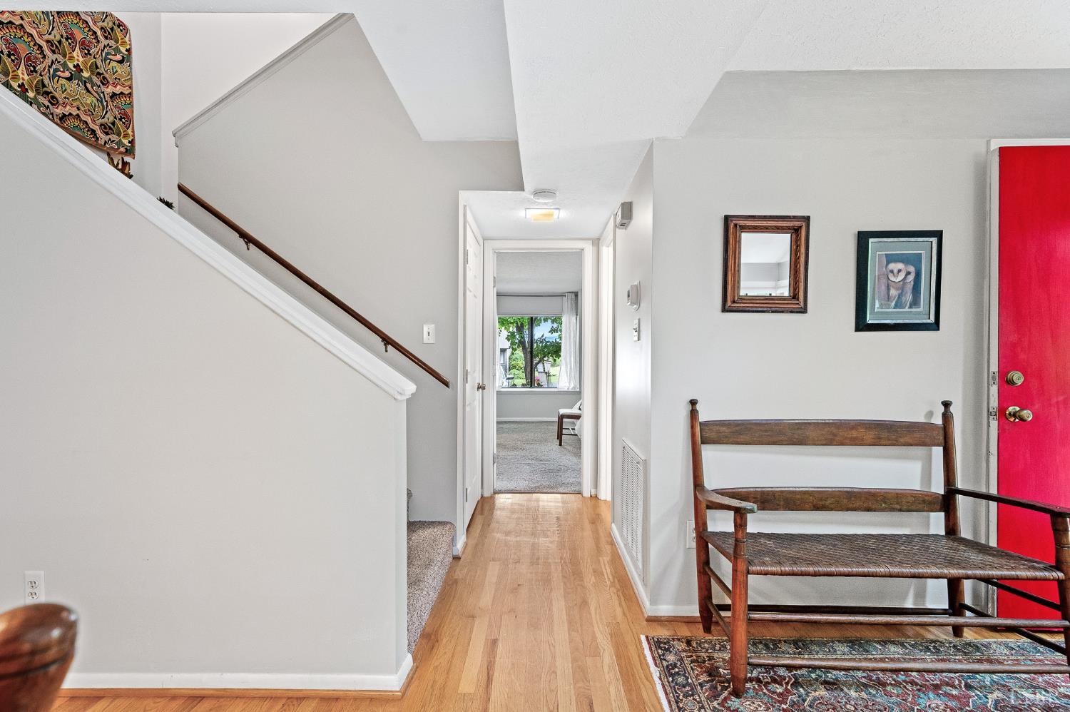 174 Sunset Ridge Road Forest, VA 24551 - Photo 13 of 43 a view of a hallway with wooden floor and staircase
