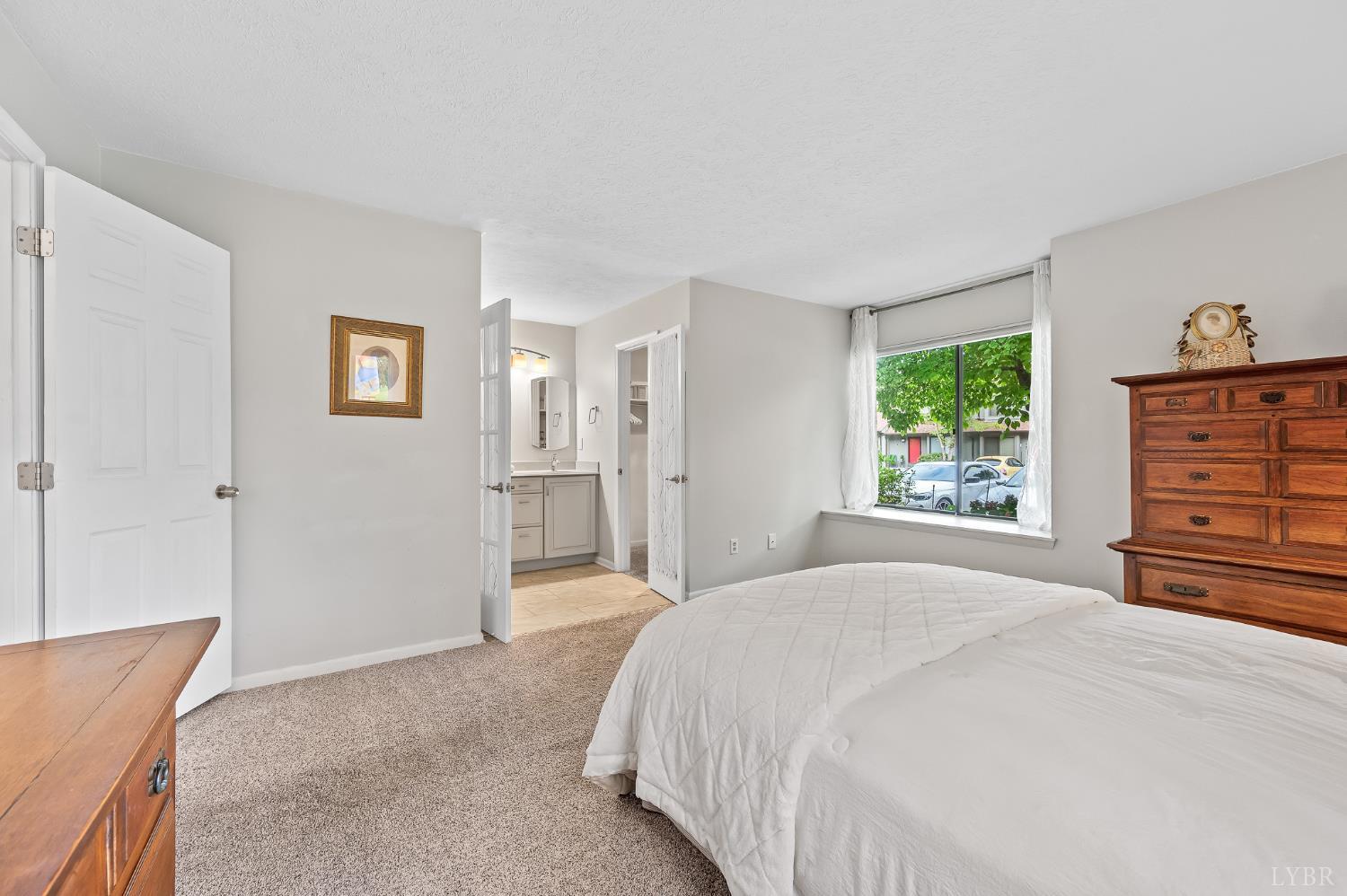 174 Sunset Ridge Road Forest, VA 24551 - Photo 17 of 43 a bedroom with a bed and a dresser