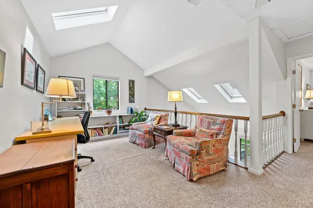 a living room with furniture and a table
