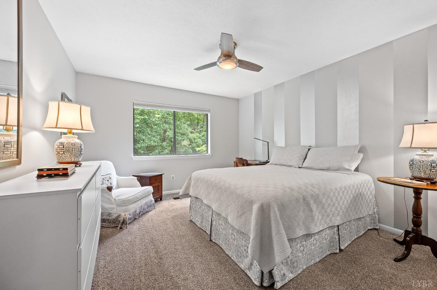 174 Sunset Ridge Road Forest, VA 24551 - Photo 27 of 43 a bedroom with a bed and a table chair