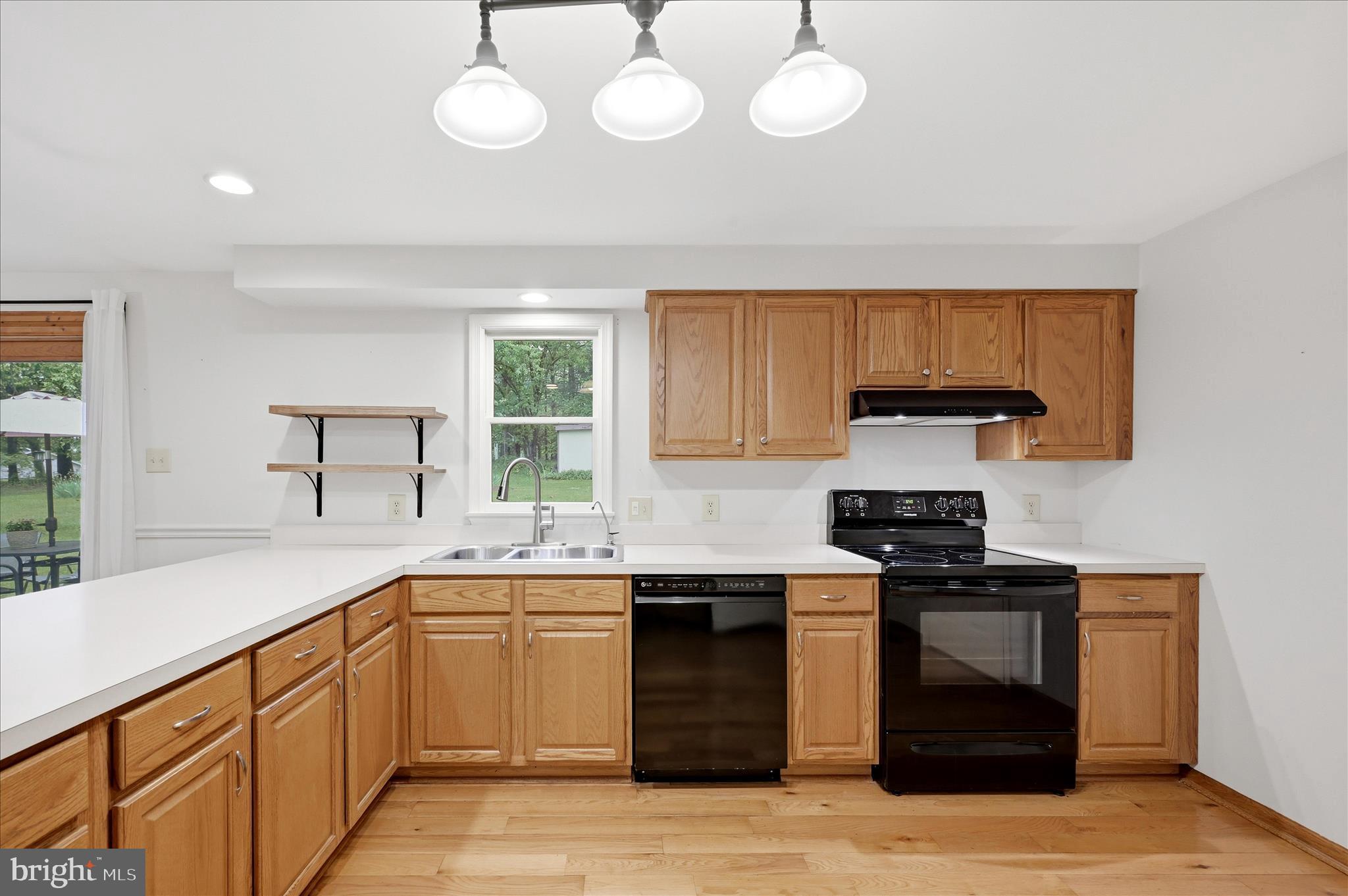244 High Banks Road Stephenson, VA 22656 - Photo 16 of 45 a kitchen with stainless steel appliances granite countertop a sink and a stove