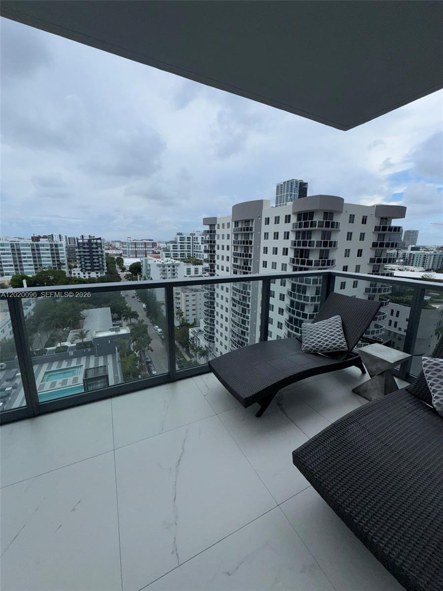 788 Northeast 23rd Street, Unit 1202 Miami, FL 33137 - Photo 40 of 64 a terrace with a bench and lake view