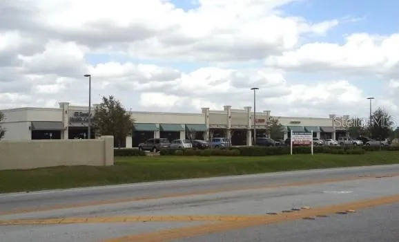 a view of a city with a big yard and a large trees