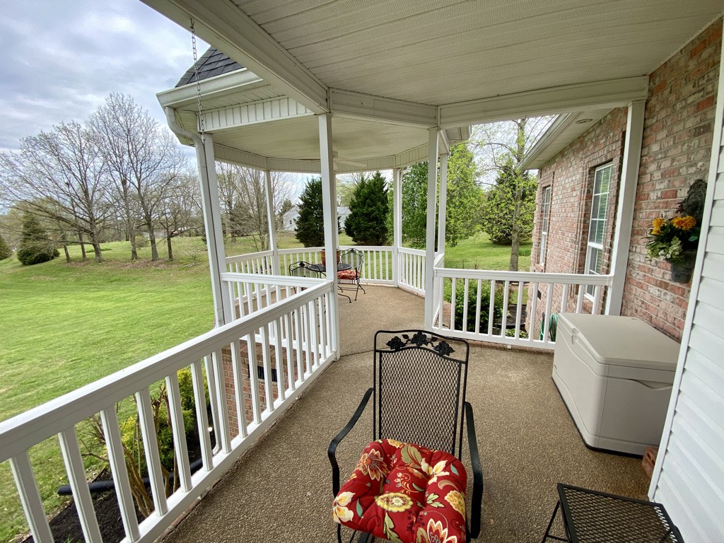 439 Ranch Road Portland, TN 37148 - Photo 8 of 49 a view of balcony with furniture and garden
