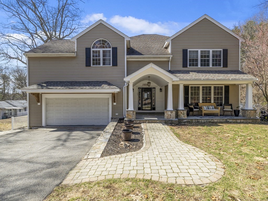 23 Vesta Road Natick, MA 01760 - Photo 1 of 30 a front view of a house with yard and balcony
