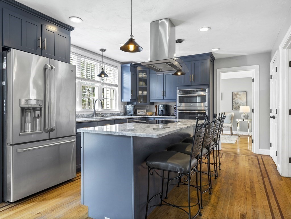23 Vesta Road Natick, MA 01760 - Photo 12 of 30 a kitchen with stainless steel appliances granite countertop a refrigerator a stove a sink and a refrigerator