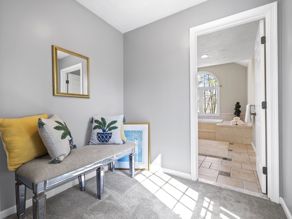 23 Vesta Road Natick, MA 01760 - Photo 17 of 30 a living room with furniture and a painting on the wall