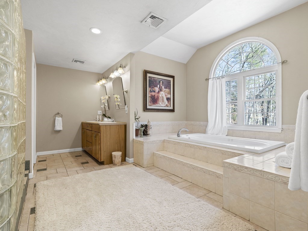 23 Vesta Road Natick, MA 01760 - Photo 18 of 30 a spacious bathroom with a tub and a large window