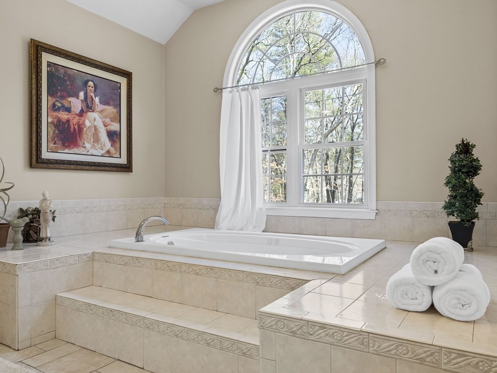 23 Vesta Road Natick, MA 01760 - Photo 19 of 30 a bathroom with a tub and a large window