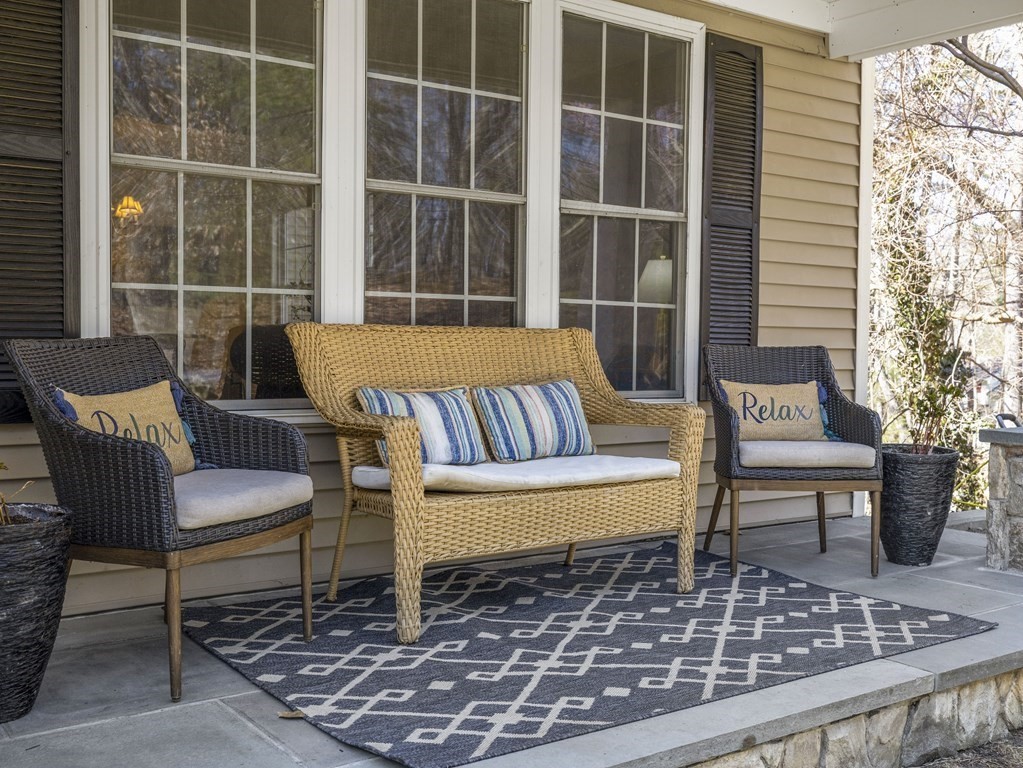 23 Vesta Road Natick, MA 01760 - Photo 2 of 30 a balcony view with a bench and a potted plant