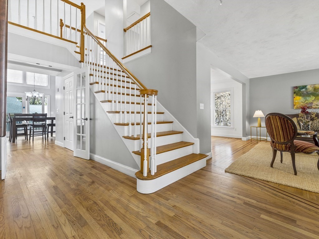 23 Vesta Road Natick, MA 01760 - Photo 3 of 30 a view of entryway and hall with wooden floor