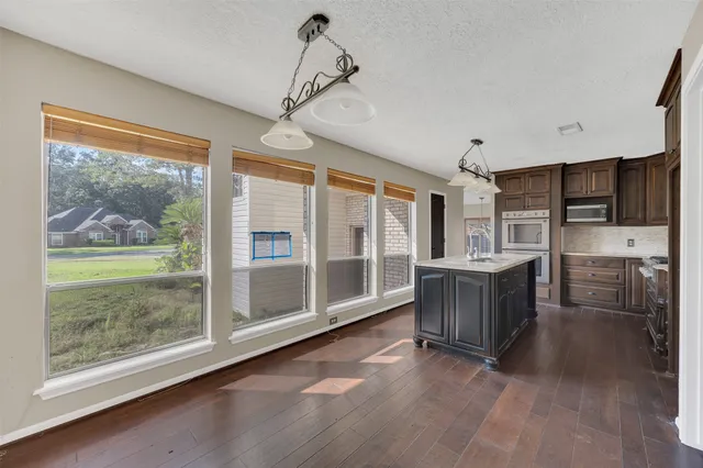 a kitchen with a cabinets and window