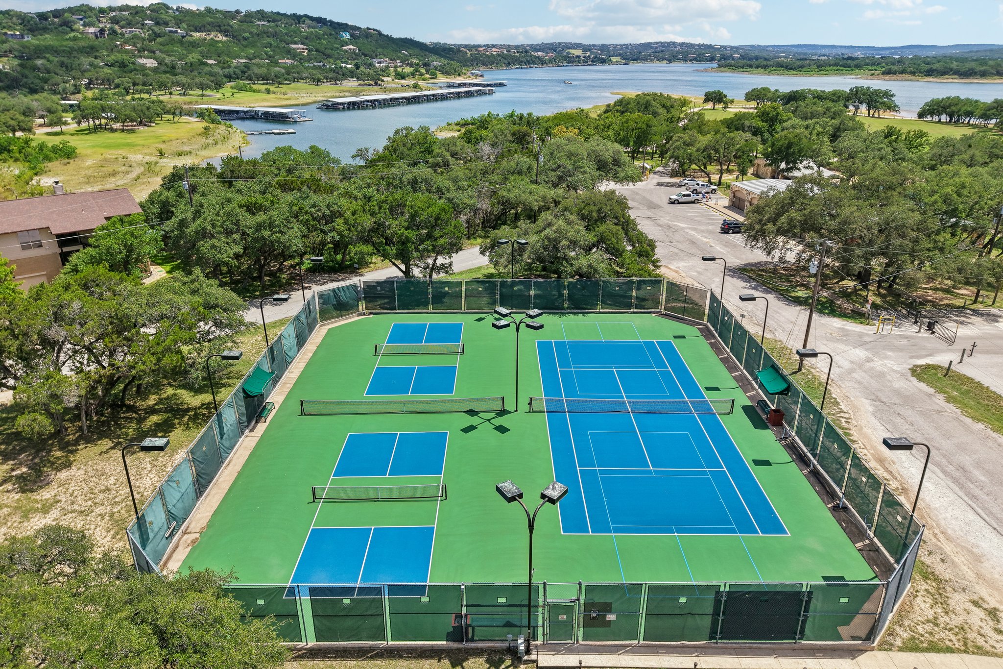 20609 Bridle Path Road Lago Vista, TX 78645 - Photo 29 of 30 Sporting amenities include a tennis court and two pickleball courts, all well-maintained for active lifestyles.