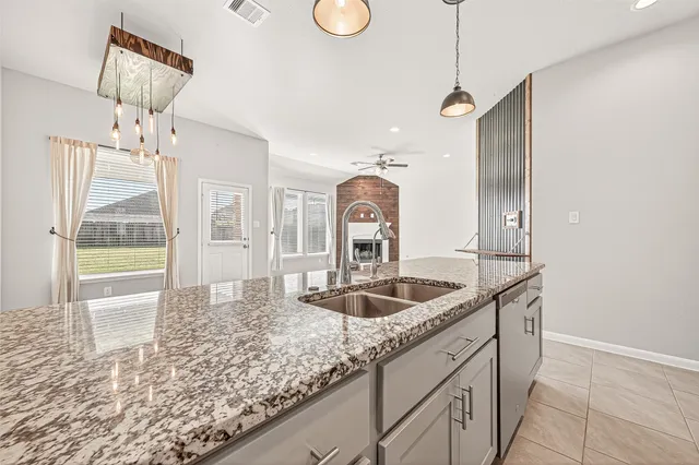 a view of a house with a big yard and large trees