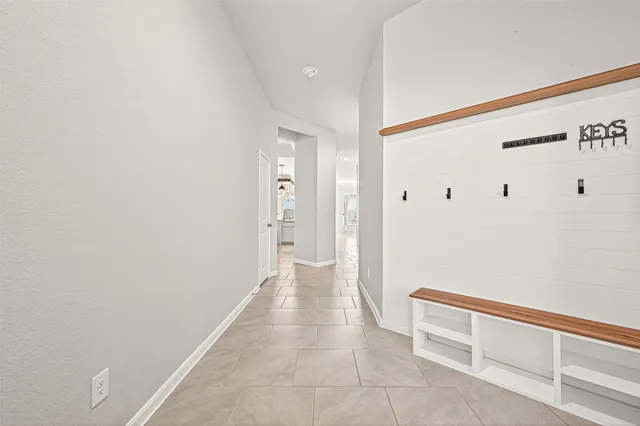 a kitchen with granite countertop white cabinets and stainless steel appliances