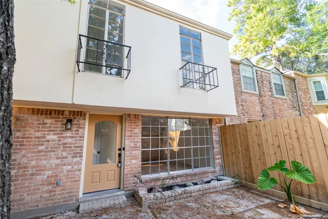 a front view of a house with a garage