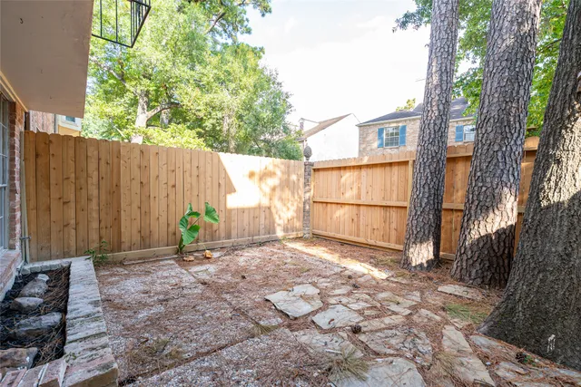 a backyard of a house with lots of green space