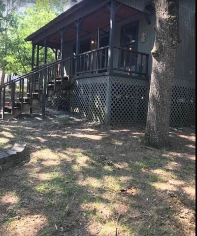 a view of street along with house and trees