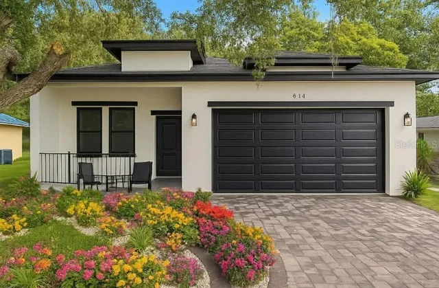 front view of a house with a yard