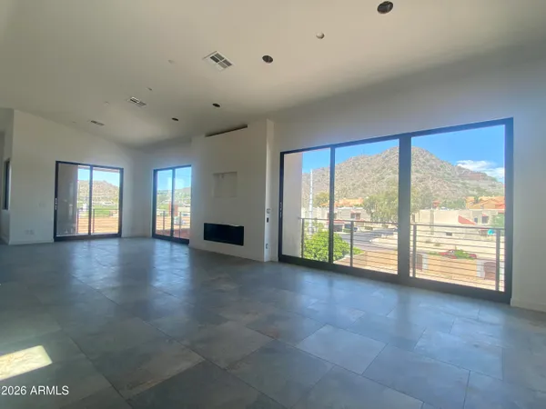 a view of an empty room with a window
