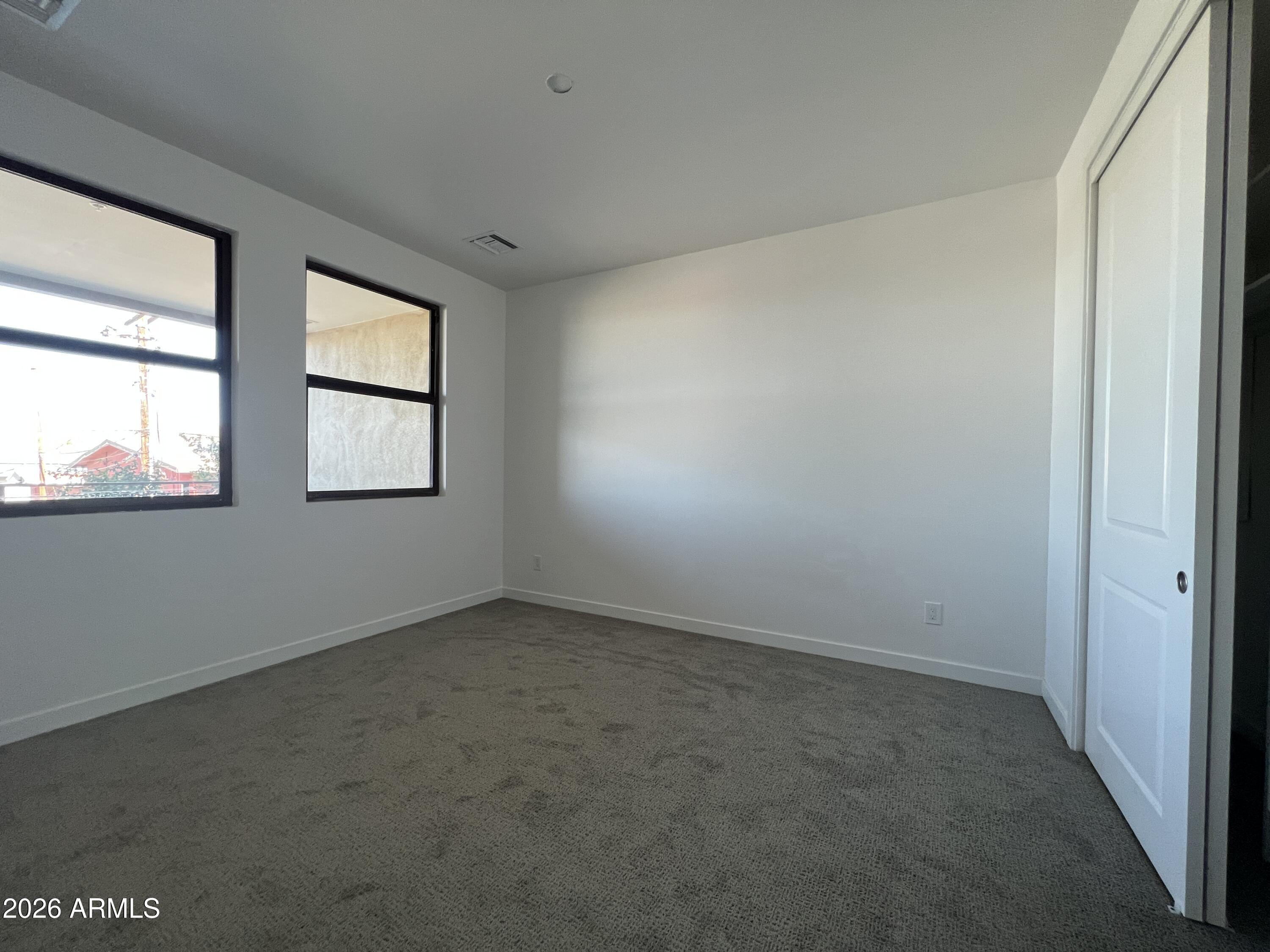 505 East Mountain View Road Phoenix, AZ 85020 - Photo 8 of 18 an empty room with windows