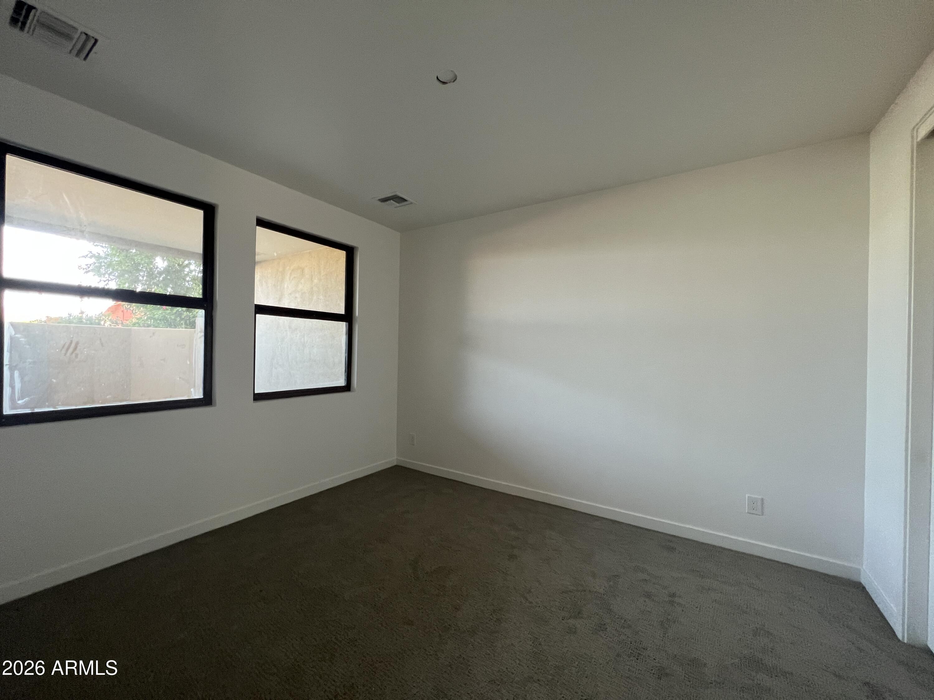 505 East Mountain View Road Phoenix, AZ 85020 - Photo 9 of 18 an empty room with windows