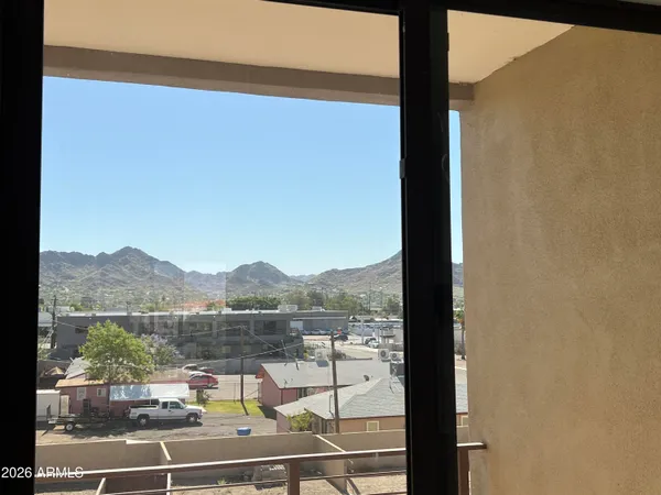 a view of a balcony with lake view and mountain view