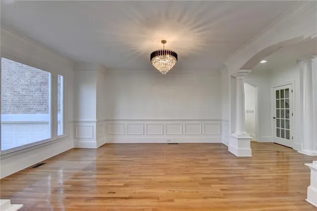 a bathroom with a double vanity sink a mirror and a bathtub