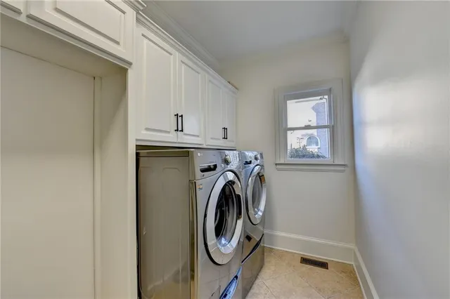 a view of a balcony with chairs and a yard