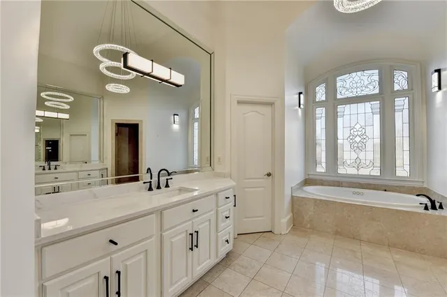 a bathroom with a sink a vanity and a mirror
