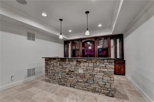 a view of empty room with wooden floor and fireplace