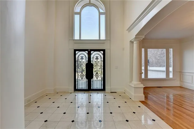 a kitchen with white cabinets appliances and a sink