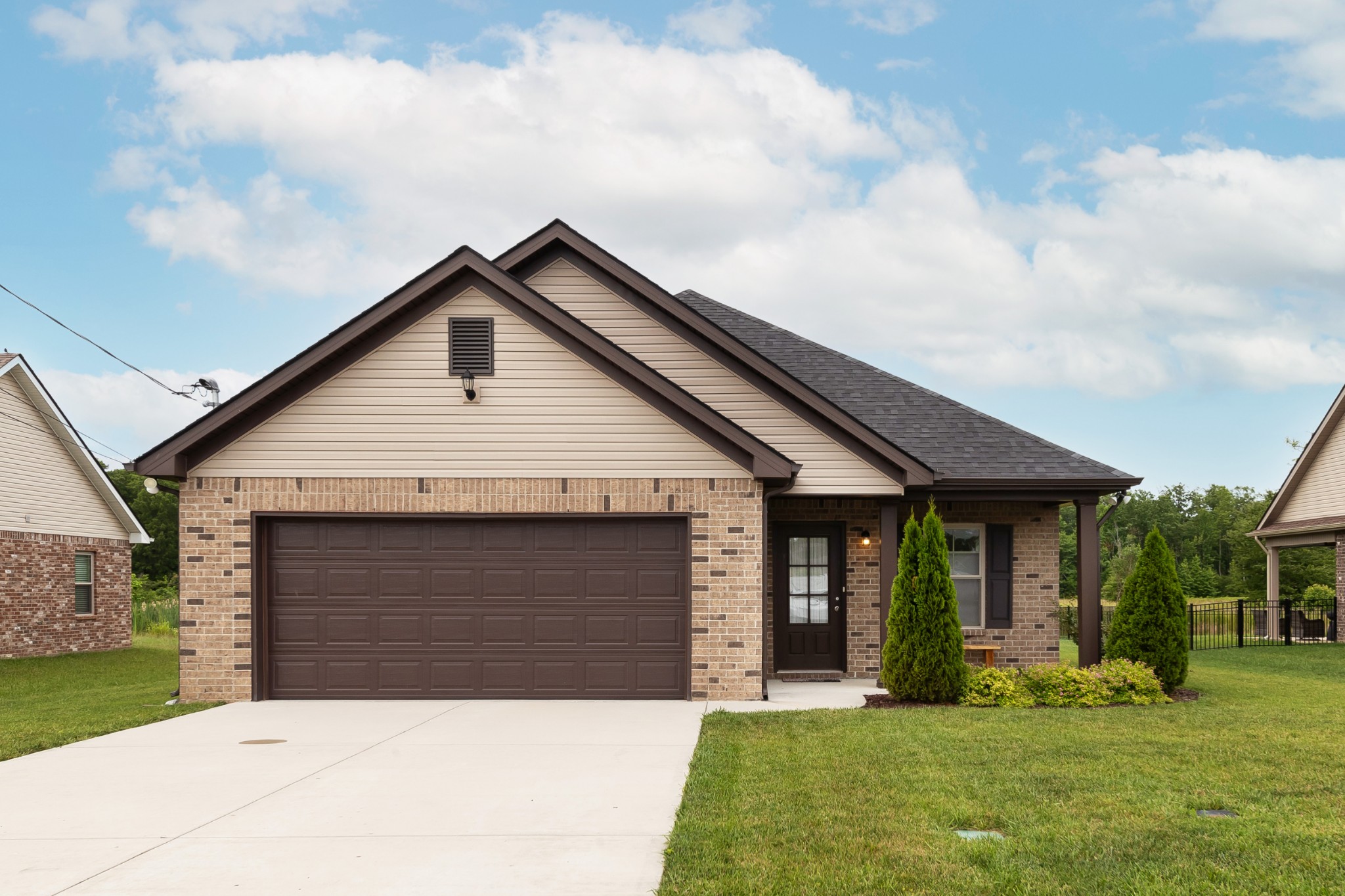 191 Preserve Circle Manchester, TN 37355 - Photo 1 of 25 a front view of a house with a yard and garage