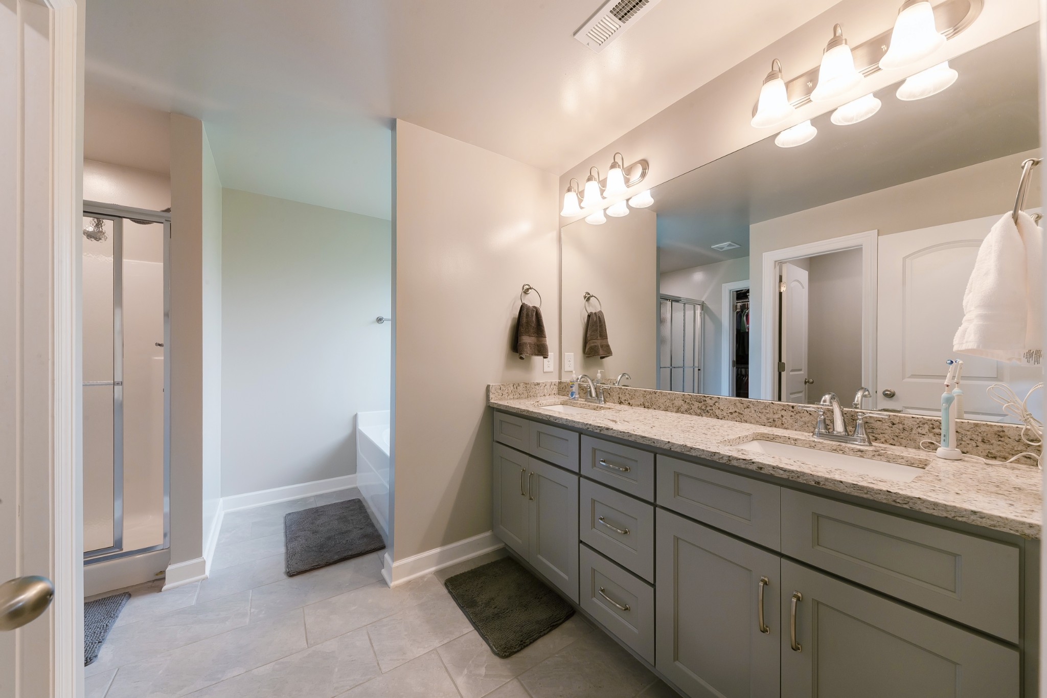 191 Preserve Circle Manchester, TN 37355 - Photo 14 of 25 a bathroom with a double vanity sink and a mirror