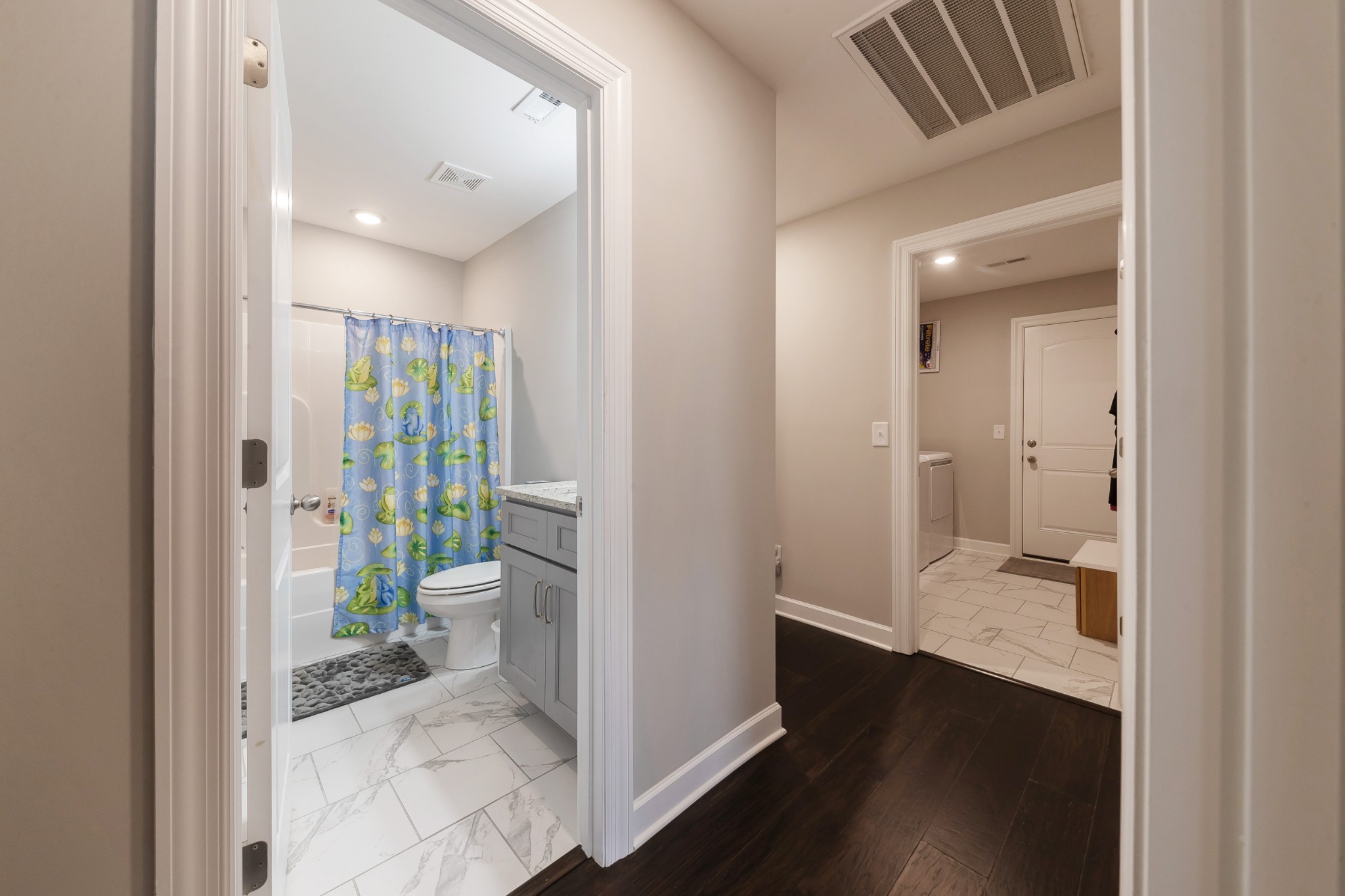 191 Preserve Circle Manchester, TN 37355 - Photo 20 of 25 a view of a hallway with wooden floor and a bathroom
