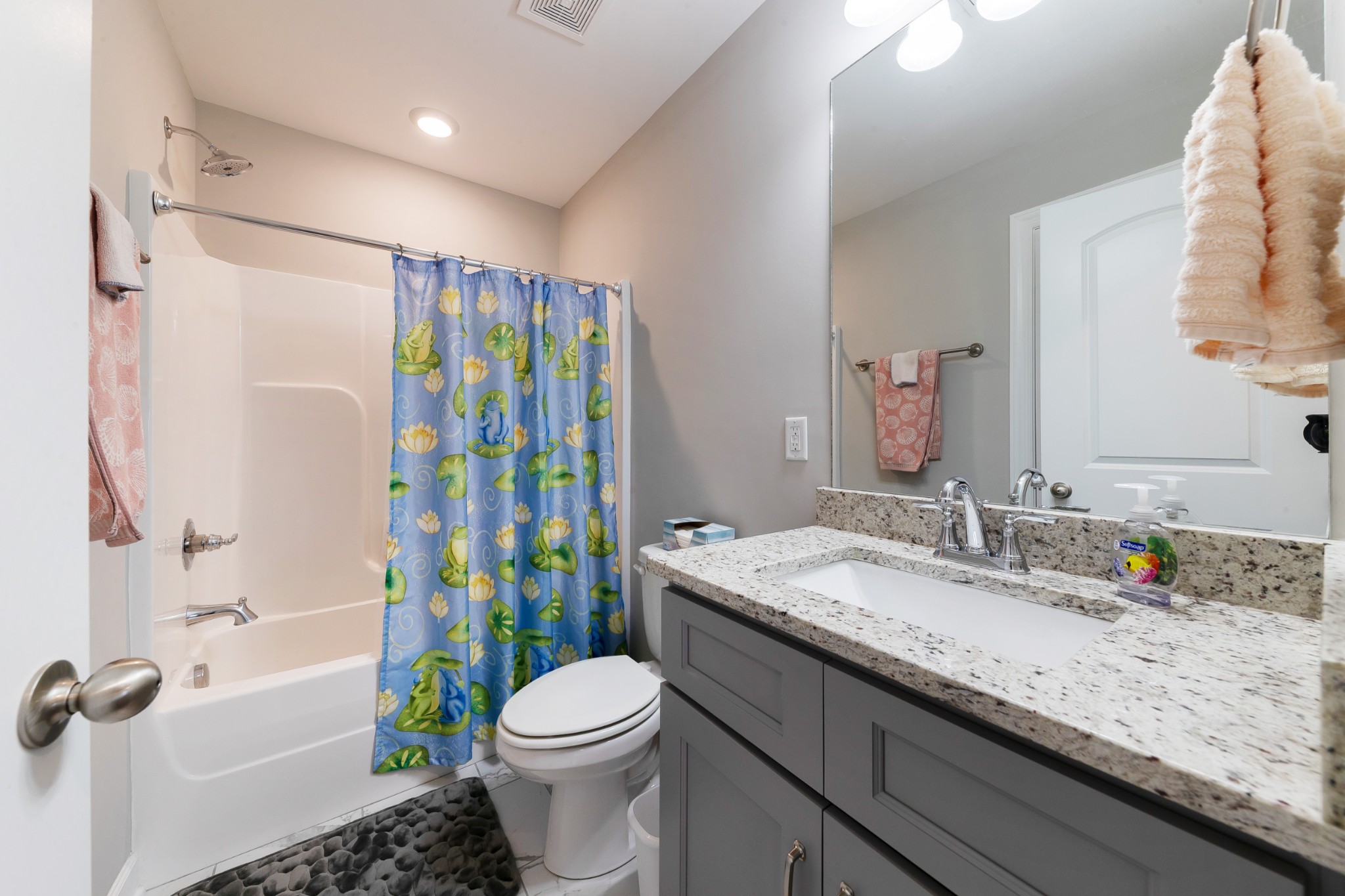 191 Preserve Circle Manchester, TN 37355 - Photo 21 of 25 a bathroom with a granite countertop toilet a sink a mirror a shower curtain and a sink
