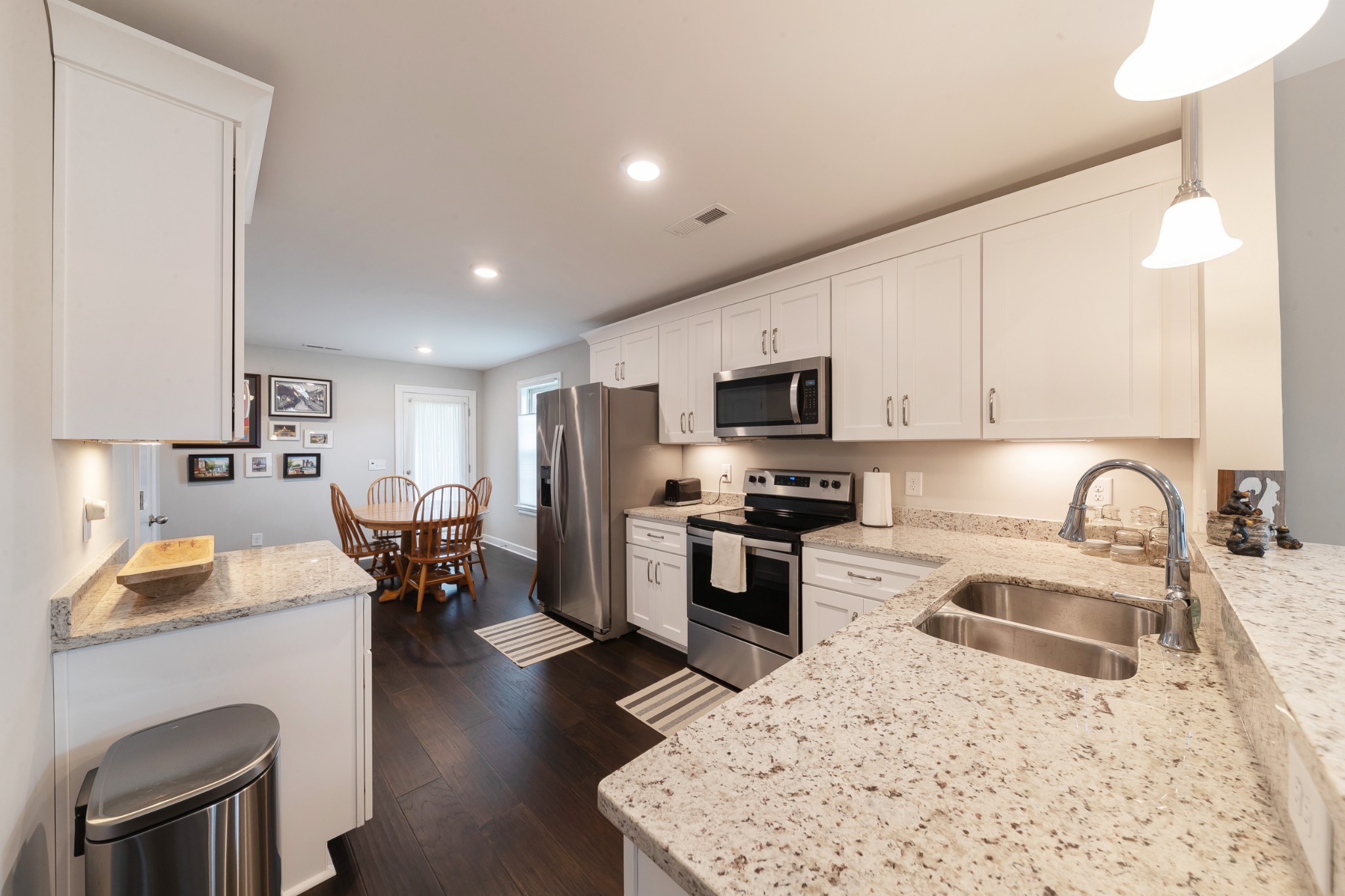 191 Preserve Circle Manchester, TN 37355 - Photo 6 of 25 a kitchen with stainless steel appliances granite countertop sink stove refrigerator and cabinets