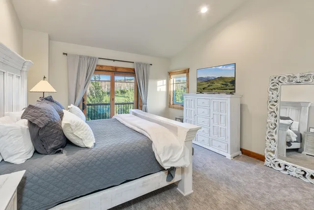 a bedroom with a bed and a cabinets