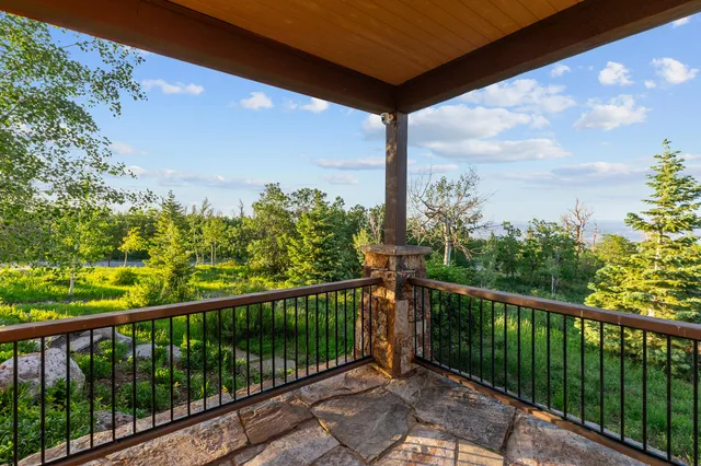 a view of a balcony with wooden fence