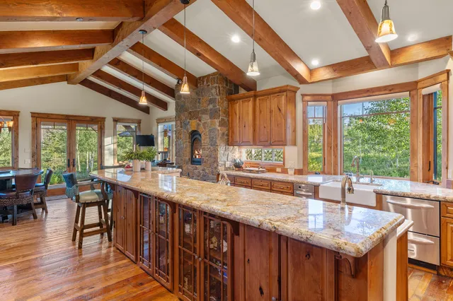a kitchen with granite countertop lots of counter top space and dining table