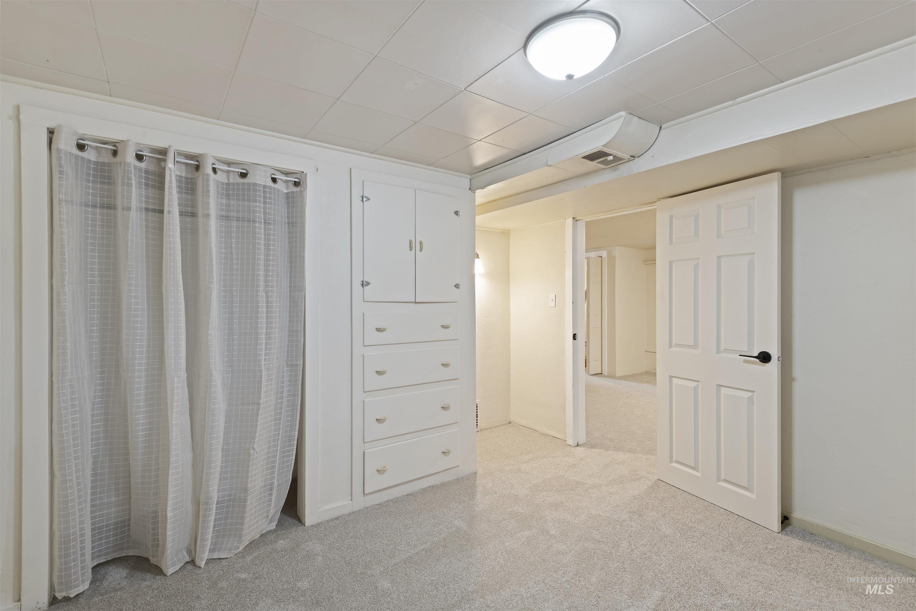1803 South Arcadia Street Boise, ID 83705 - Photo 24 of 30 Interior space with light colored carpet and a drop ceiling