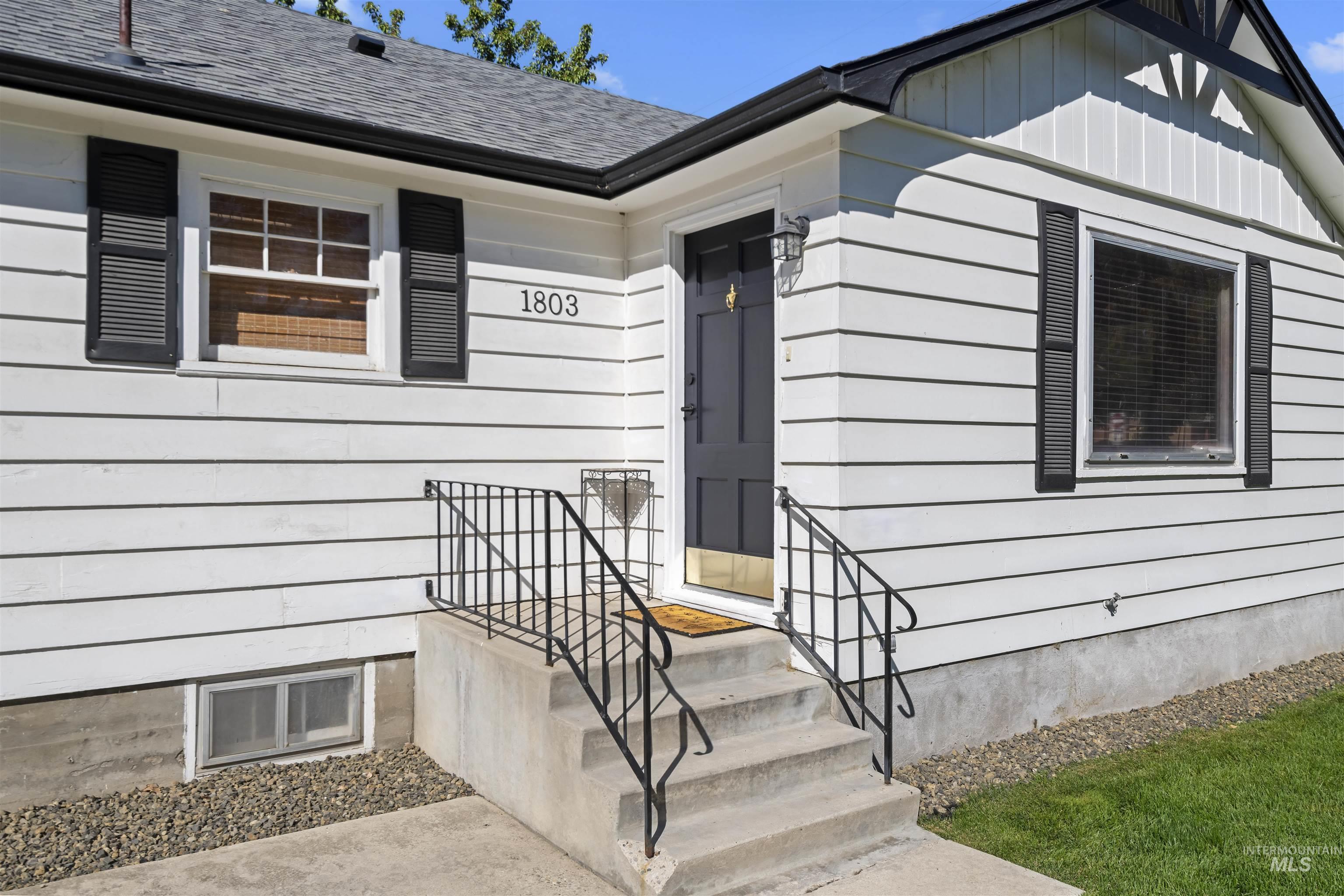 1803 South Arcadia Street Boise, ID 83705 - Photo 3 of 30 Entrance to property featuring roof with shingles and board and batten siding
