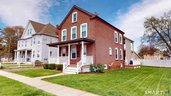 a front view of a house with a yard